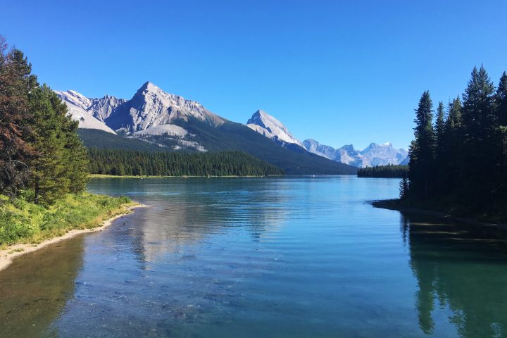 a body of water with Maligne Lake in the middle of a lake