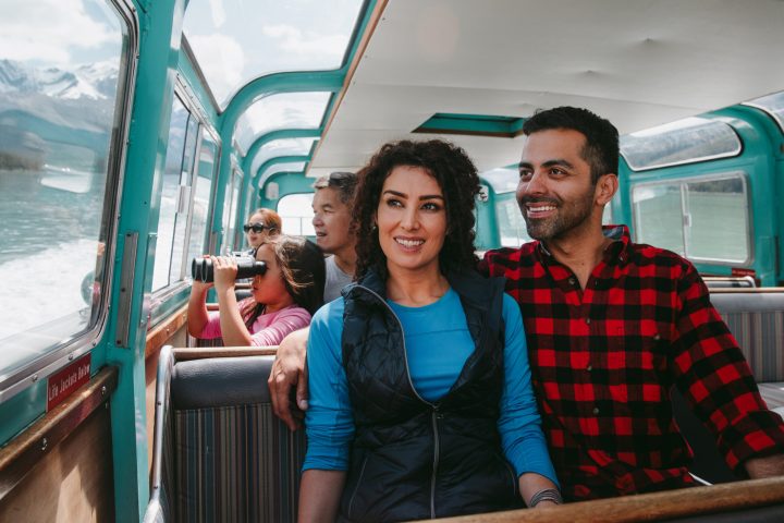 Tariq Marshall, Lisa Ray sitting on a train
