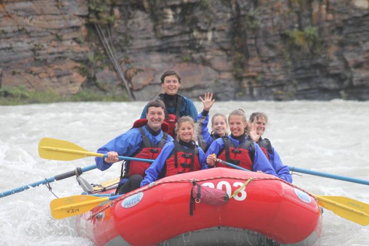 a person in a red raft in the water