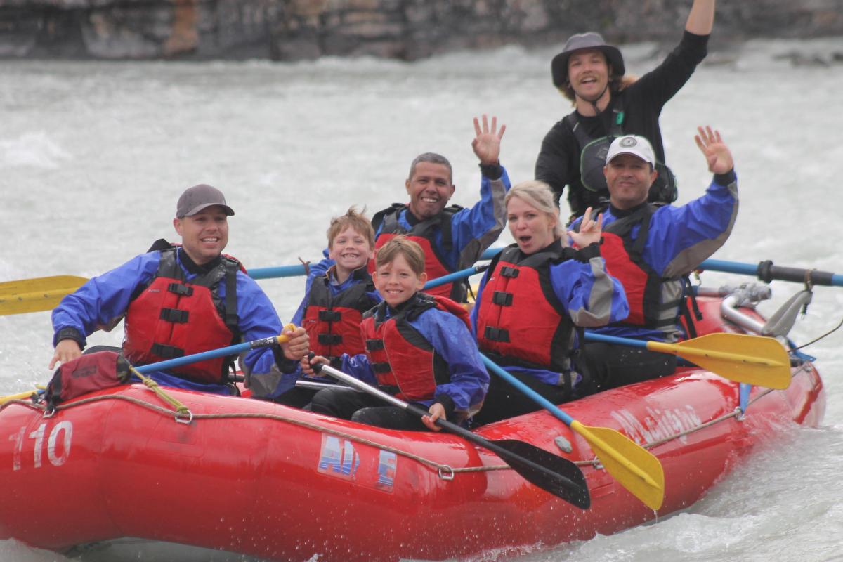 Athabasca Falls Canyon Run Image 12 a group of people riding on the back of a boat