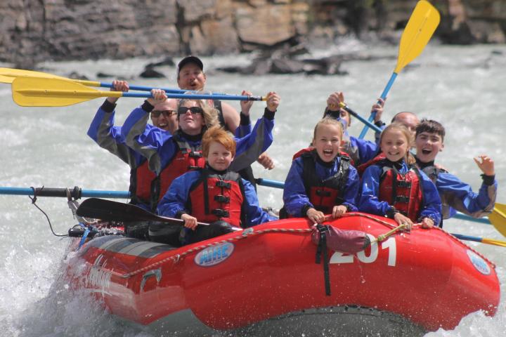 a group of people on a raft in the water