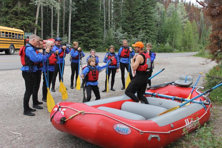 a group of people on a raft