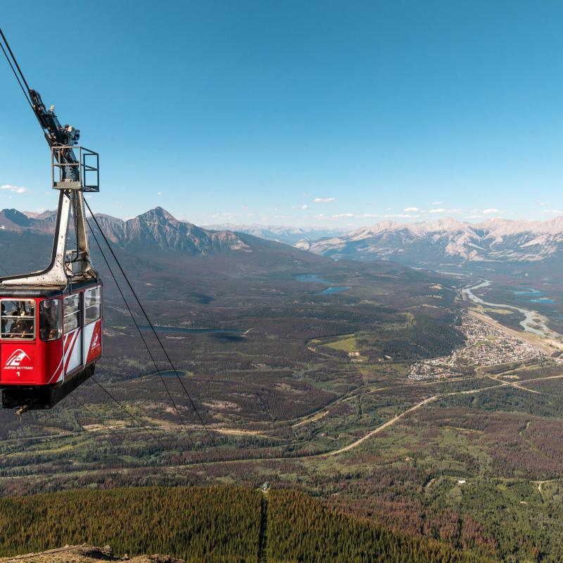 a large body of water with a mountain in the background