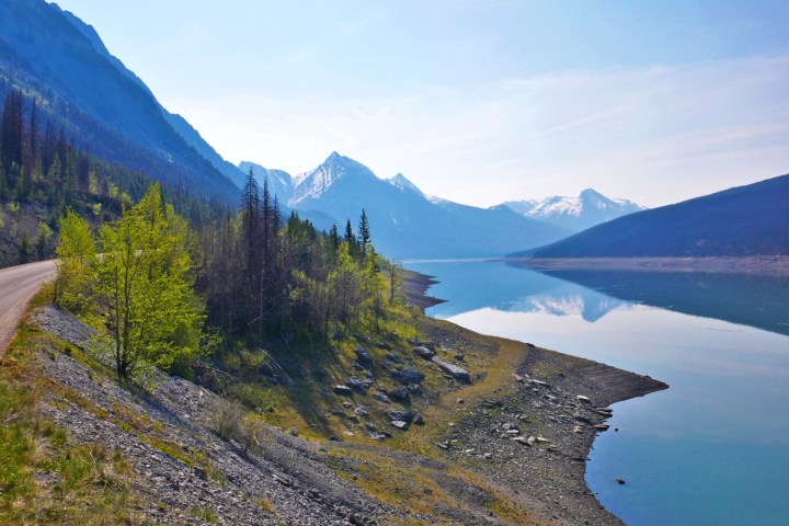 a body of water with a mountain in the background