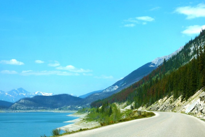 a body of water with a mountain in the background