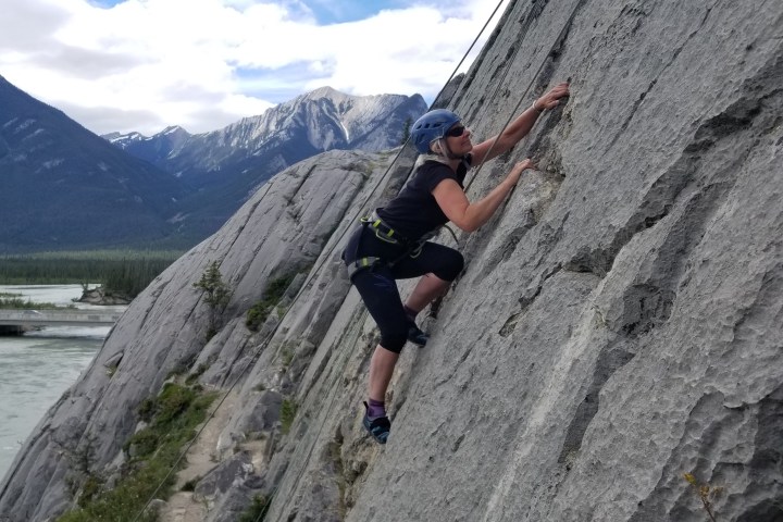 a man riding a skateboard up the side of a mountain