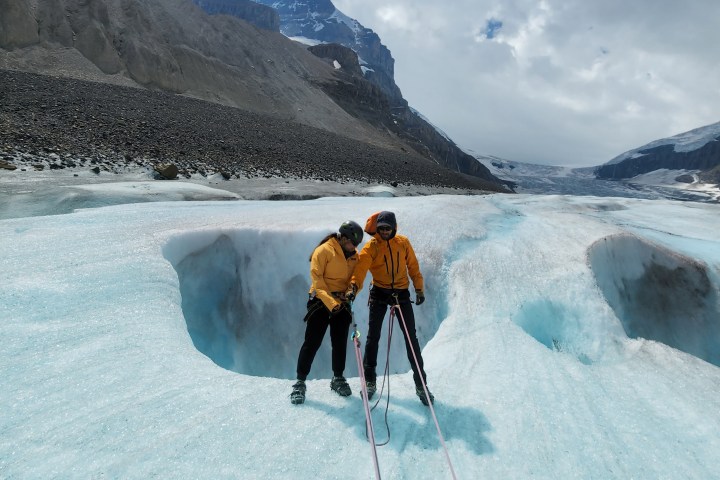 a man is cross country skiing on a snow covered mountain
