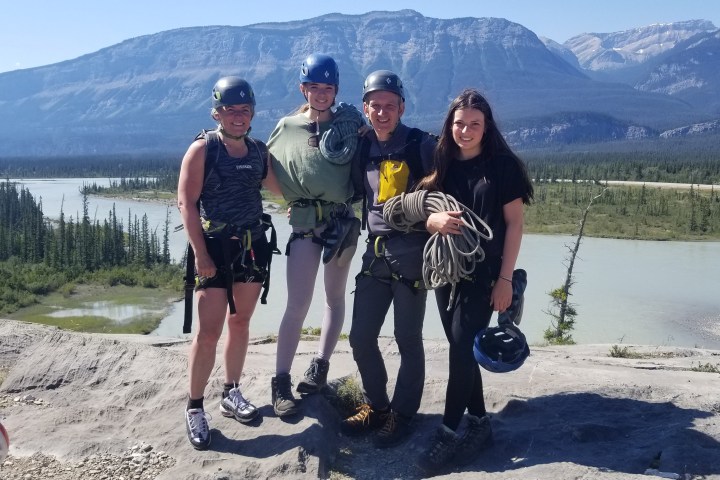 a couple of people on a beach posing for the camera